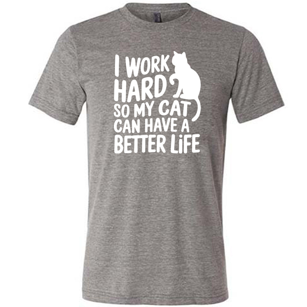 Grey colored shirt with cat silhouette graphic on it that says "I Work Hard So My Cat Can Have A Better Life"