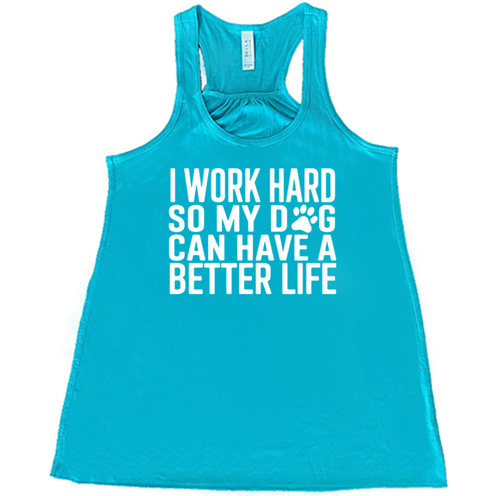 Teal colored flowy tank with paw print graphic on it that says "I Work Hard So My Dog Can Have A Better Life"