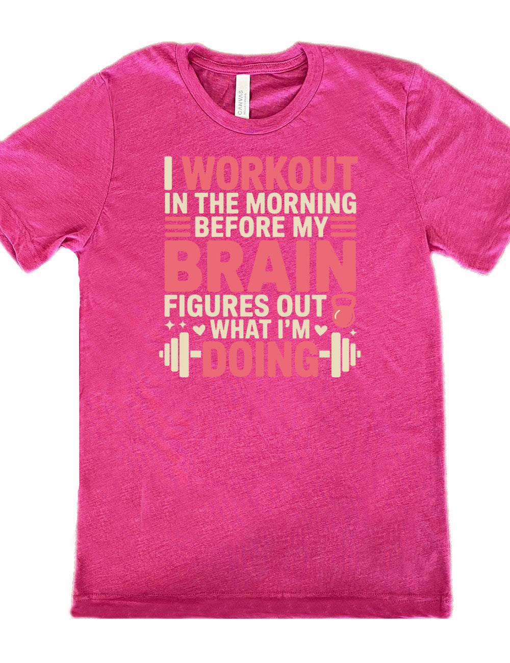 berry unisex tee with words on it saying "I workout in the morning before my brain figures out what I'm doing", with the graphics of lines, a kettlebell, a couple stars and hearts, and a barbell