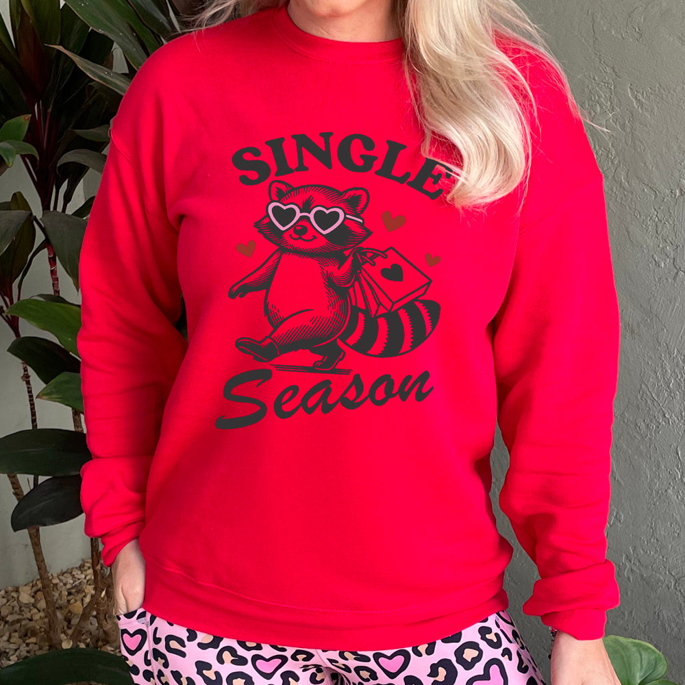 red crewneck with the text "Single Season" on it