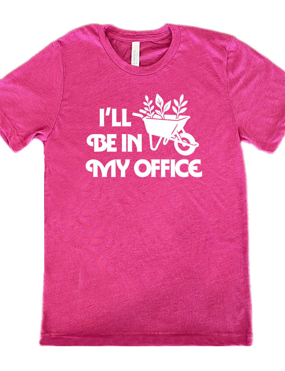 berry unisex tee with the words "I'll be in my office" next to the graphic of a wheelbarrow, with three plants sticking out of it
