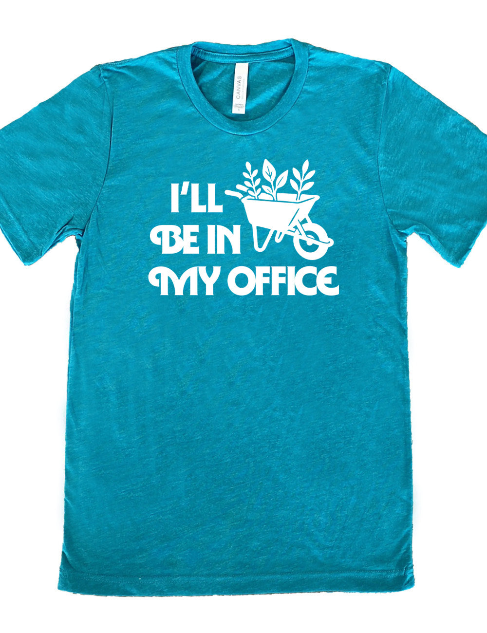 teal unisex tee with the words "I'll be in my office" next to the graphic of a wheelbarrow, with three plants sticking out of it
