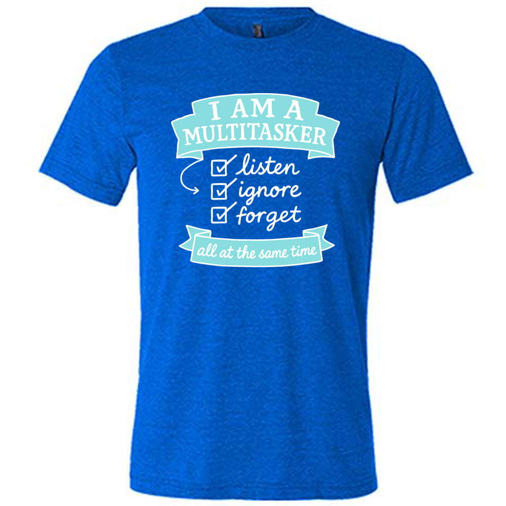 Blue Unisex Tee, with wording I am a Multitasker listen ignore forget all at the same time, checkmarks, an arrow, and banners