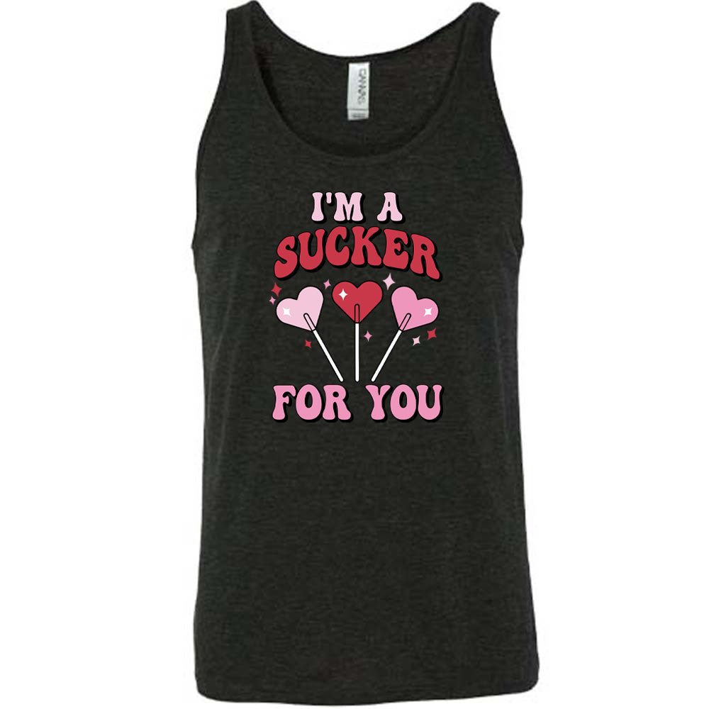 black shirt with the text "I'm A Sucker For You" on it