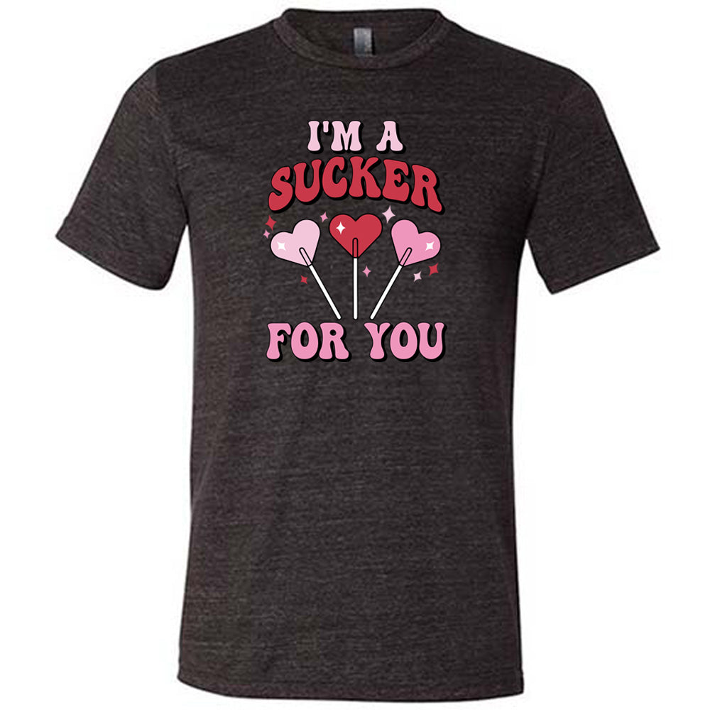 black shirt with the text "I'm A Sucker For You" on it