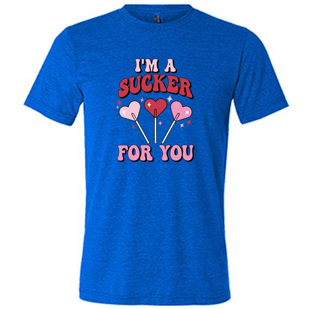 blue shirt with the text "I'm A Sucker For You" on it