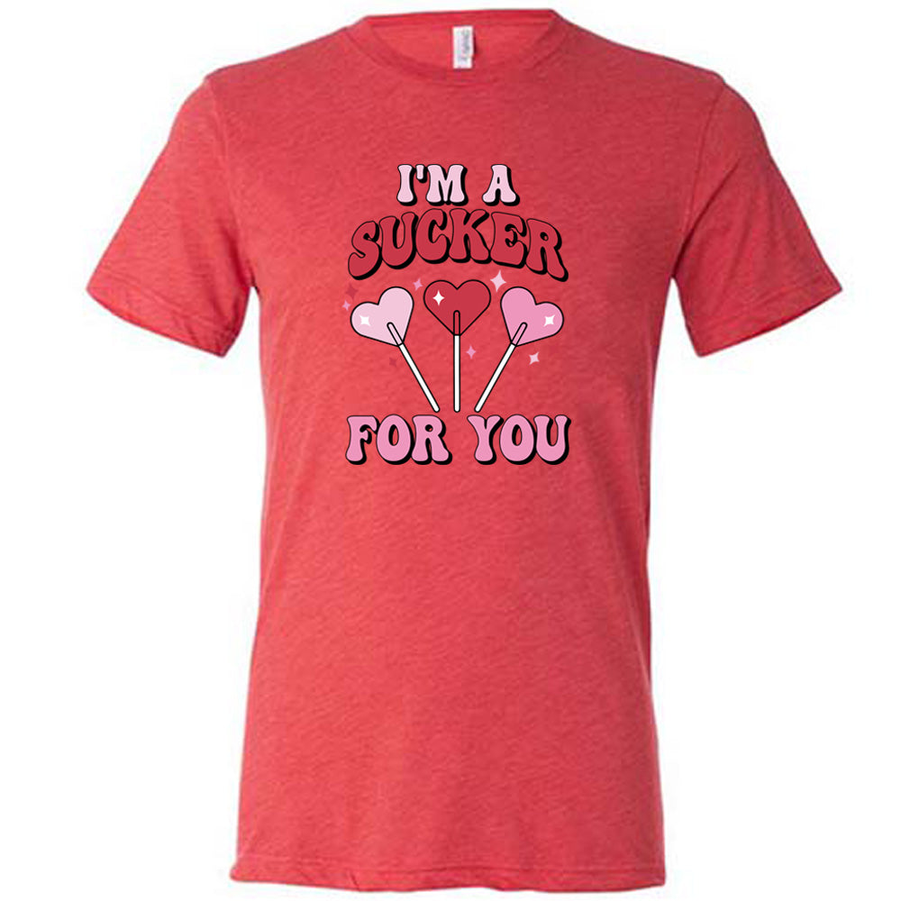 red shirt with the text "I'm A Sucker For You" on it