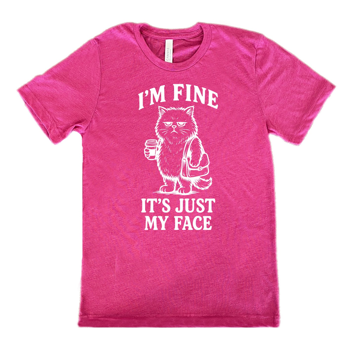 berry unisex tee with the words "I'm fine it's just my face" on it, around the graphic of a cat with a resting-grumpy face, holding a coffee and wearing a purse