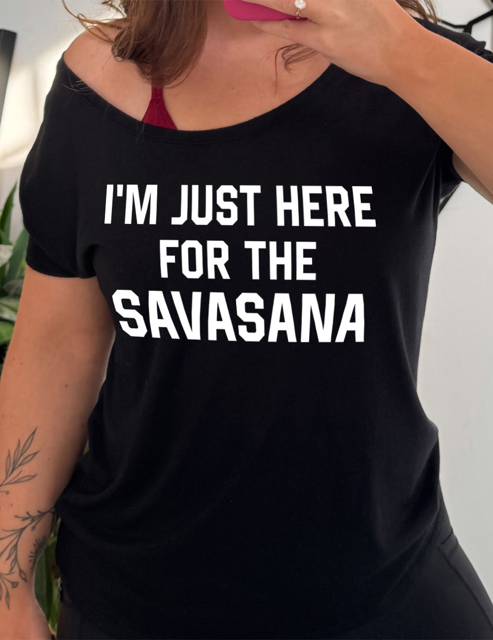 black slouchy tee with the words "I'm just here for the savasana" on it