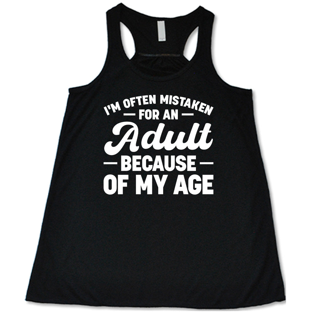 black flowy tank with the words "I'm often mistaken for an adult because of my age" on it