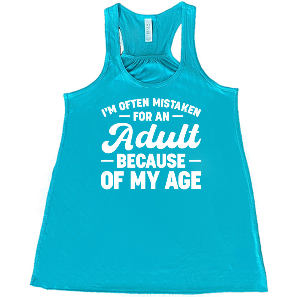 teal flowy tank with the words "I'm often mistaken for an adult because of my age" on it