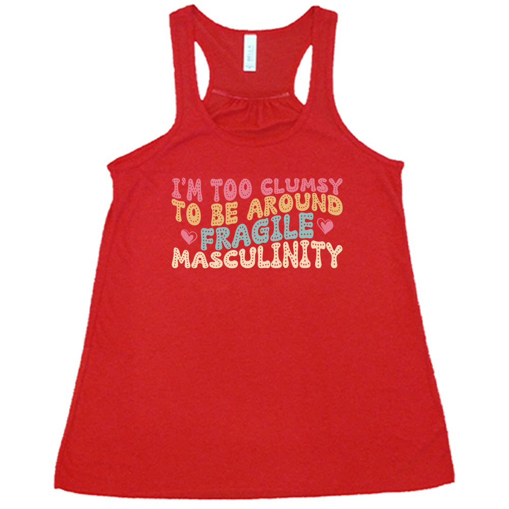 Red colored flowy tank with a graphic on it that says "I'm Too Clumsy To Be Around Fragile Masculinity"