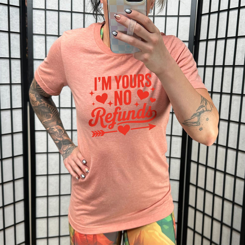 coral shirt with the text "I'm Yours, No Refunds" on it