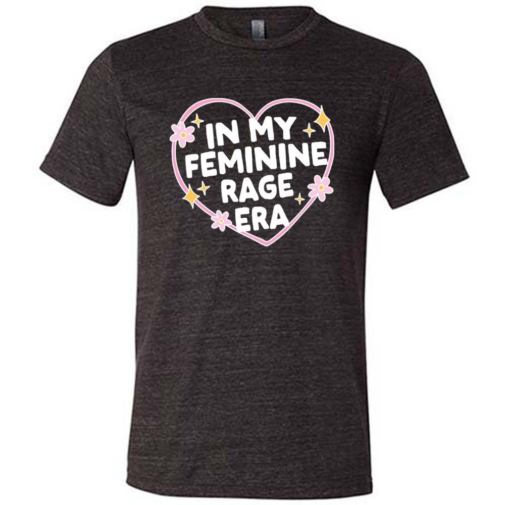 black unisex tee with the words "in my feminine rage era" within a heart, with scattered flowers and stars