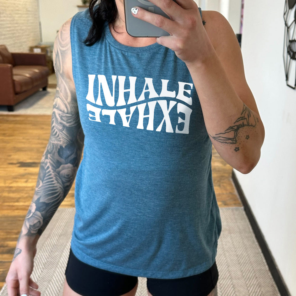 Deep teal muscle tank with the words "inhale exhale" on it, with the word "exhale" upside down and backwards, giving almost a yin and yang effect
