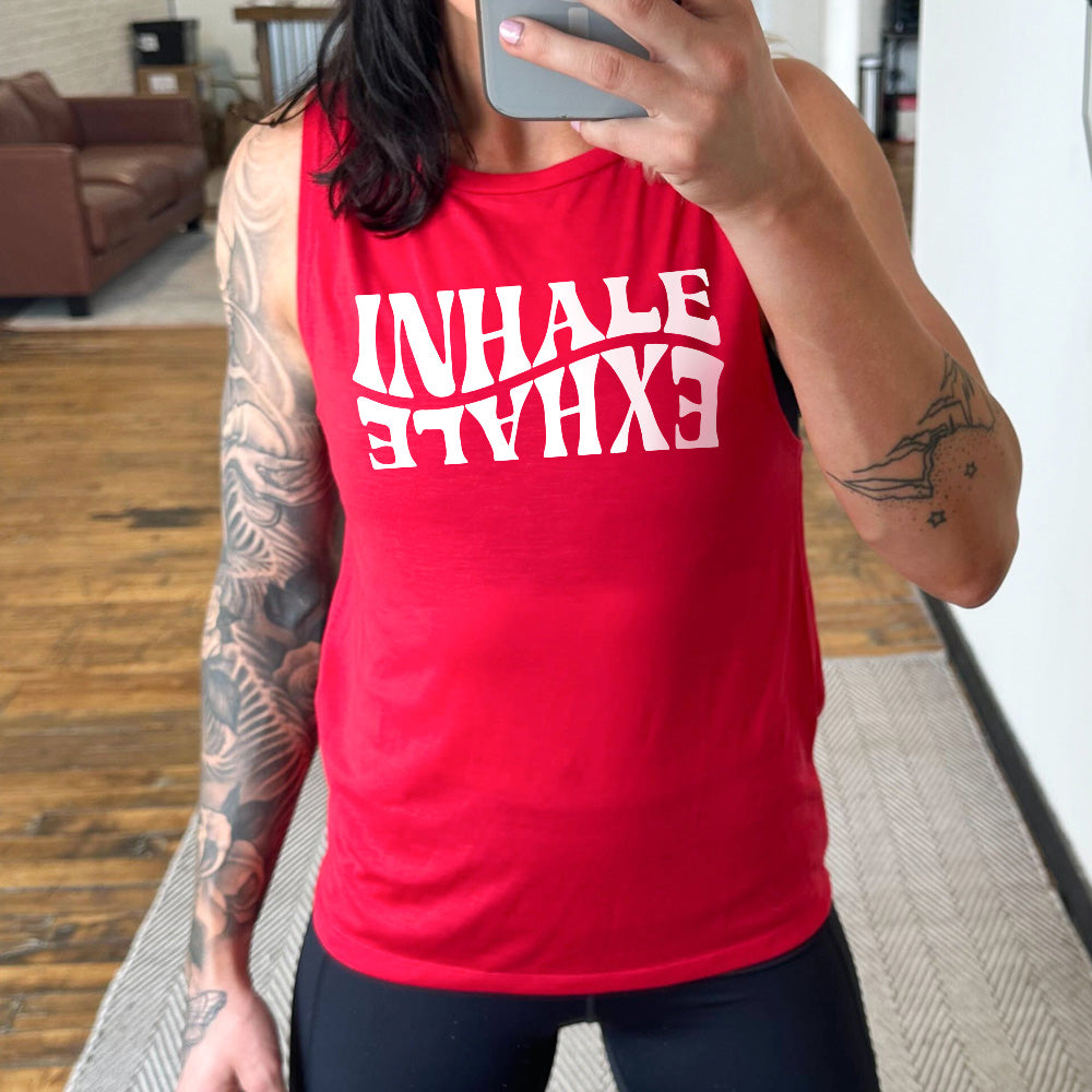 Red muscle tank with the words "inhale exhale" on it, with the word "exhale" upside down and backwards, giving almost a yin and yang effect