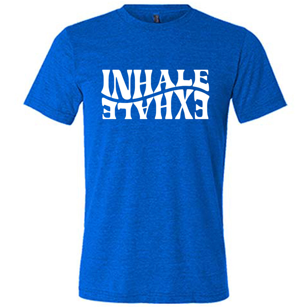 Blue unisex tee with the words "inhale exhale" on it, with the word "exhale" upside down and backwards, giving almost a yin and yang effect