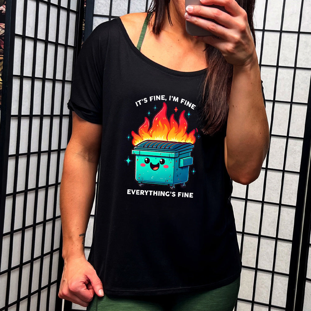 black slouchy shirt with a graphic of a dumpster on fire with the text "It's Fine I'm Fine Everything Is Fine" on it
