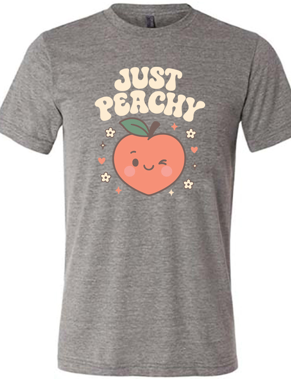 grey unisex tee with the graphic of a winking peach, surrounded by little hearts, flowers, and stars, with the words above it saying "just peachy"