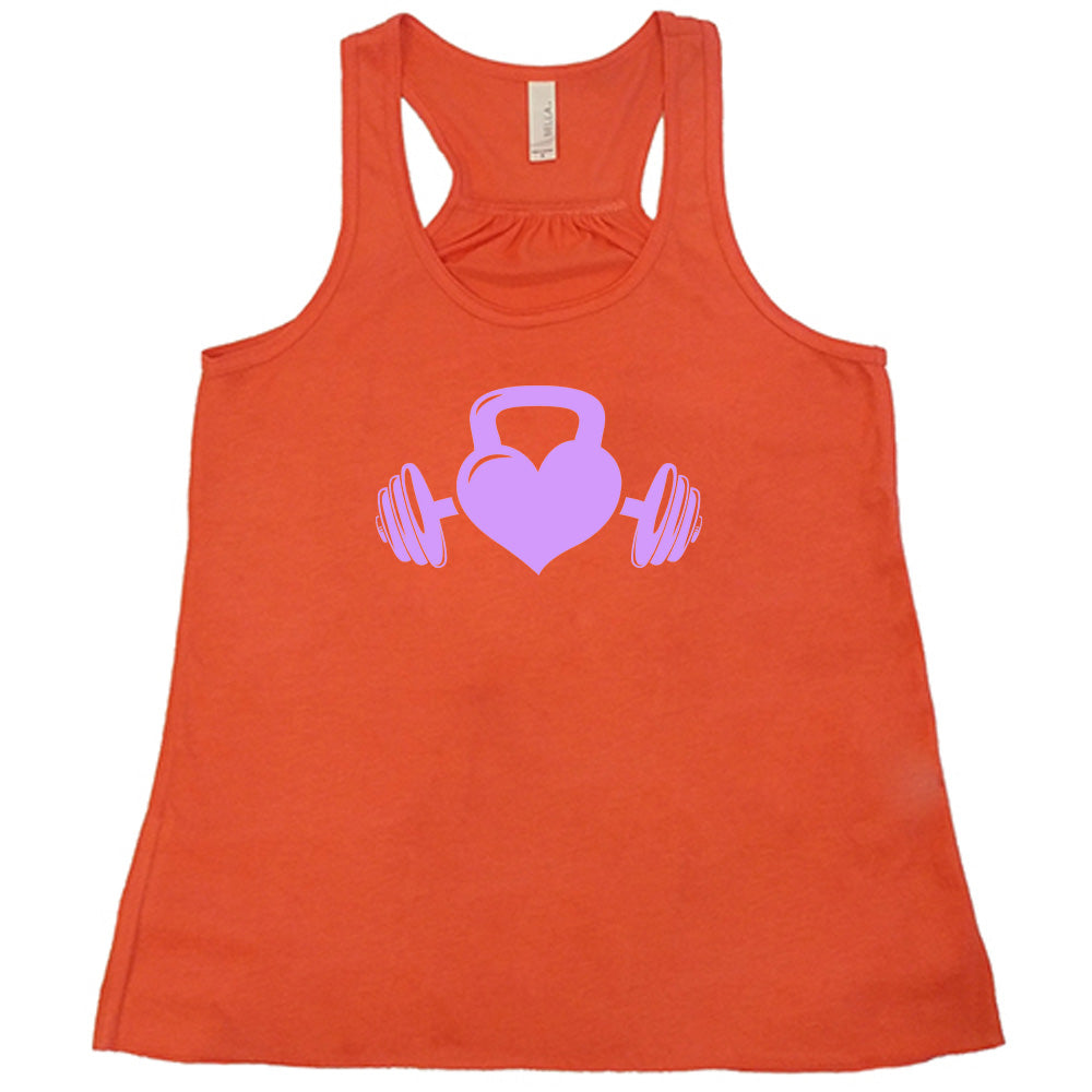 coral shirt with a light purple Kettlebell Heart graphic on it