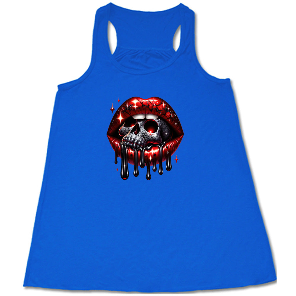 blue shirt with a skull and lip graphic on it