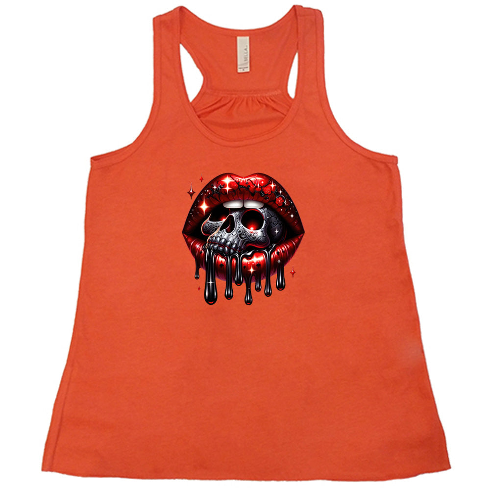 coral shirt with a skull and lip graphic on it