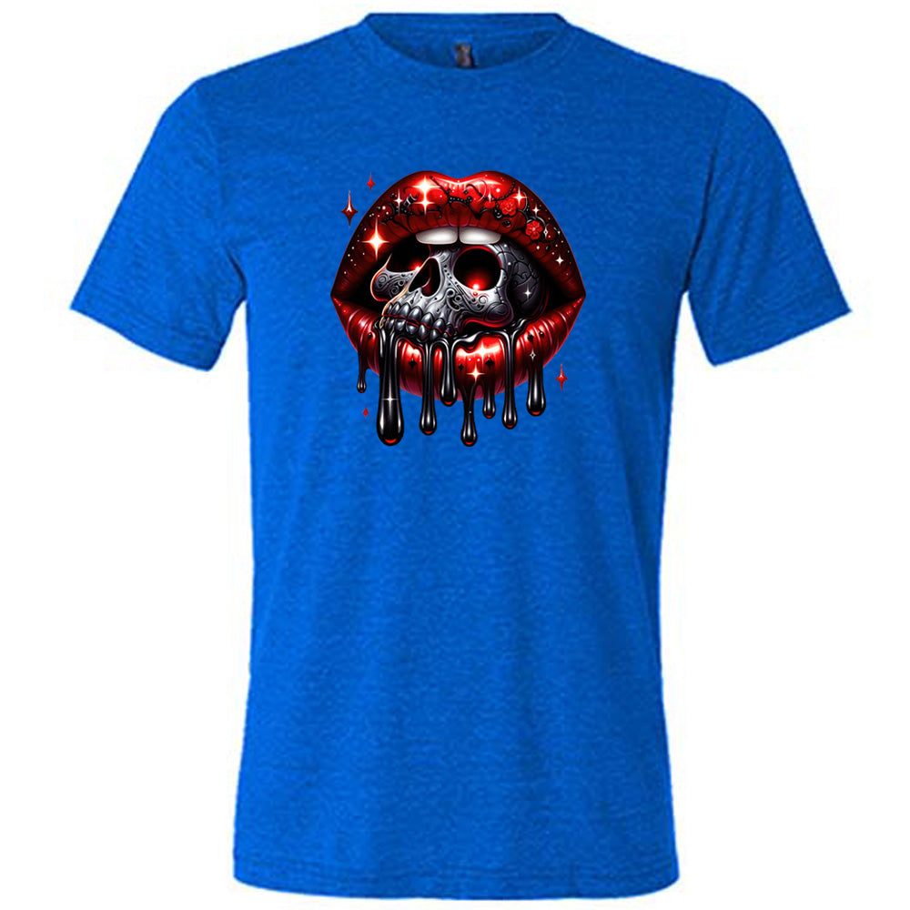 blue shirt with a skull and lip graphic on it