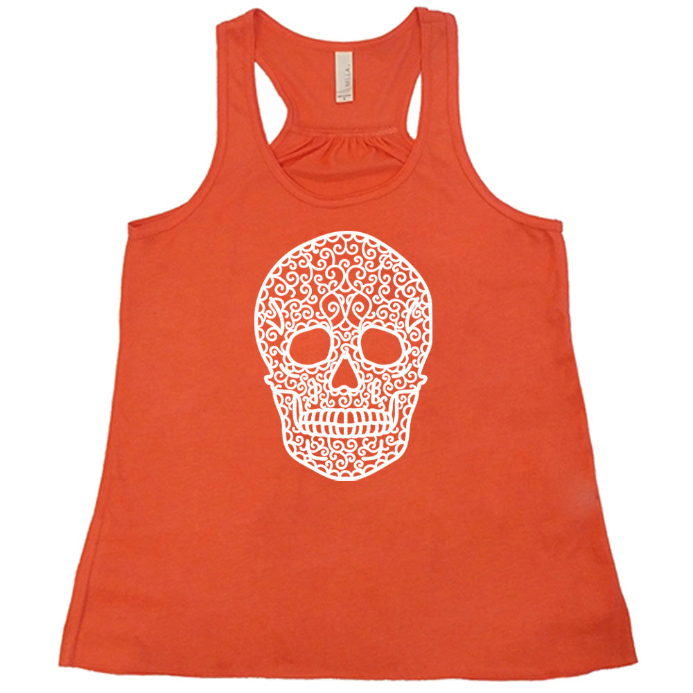 coral flowy tank with the graphic of a large lacy skull
