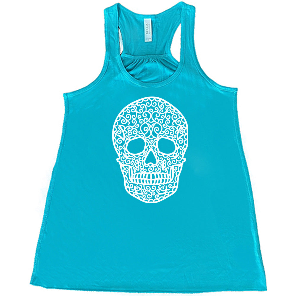 teal flowy tank with the graphic of a large lacy skull