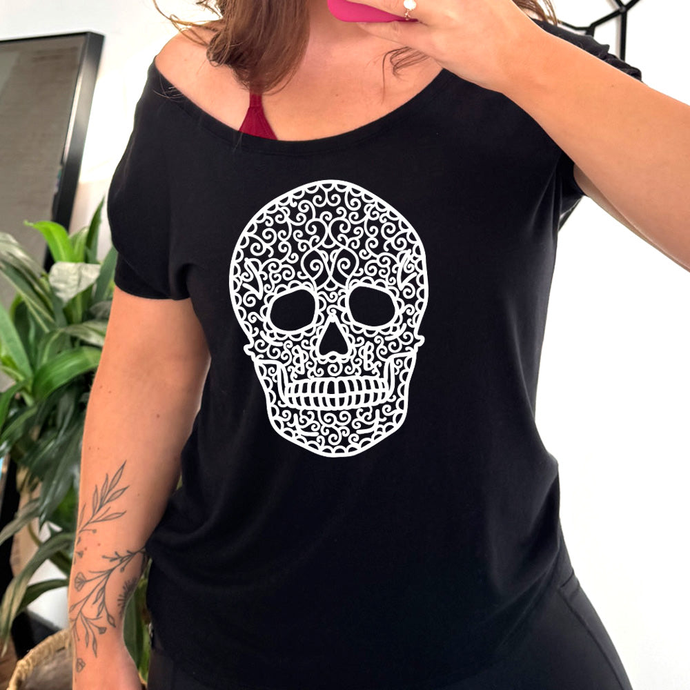black slouchy tee with the graphic of a large lacy skull