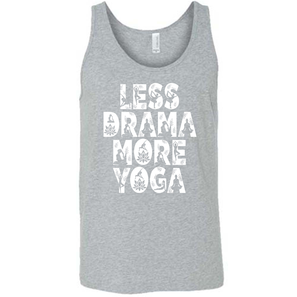grey unisex tank with the words "less drama more yoga" on it, and within each letter there are silhouettes of people doing yoga poses as well as some lotus flowers and some leaves