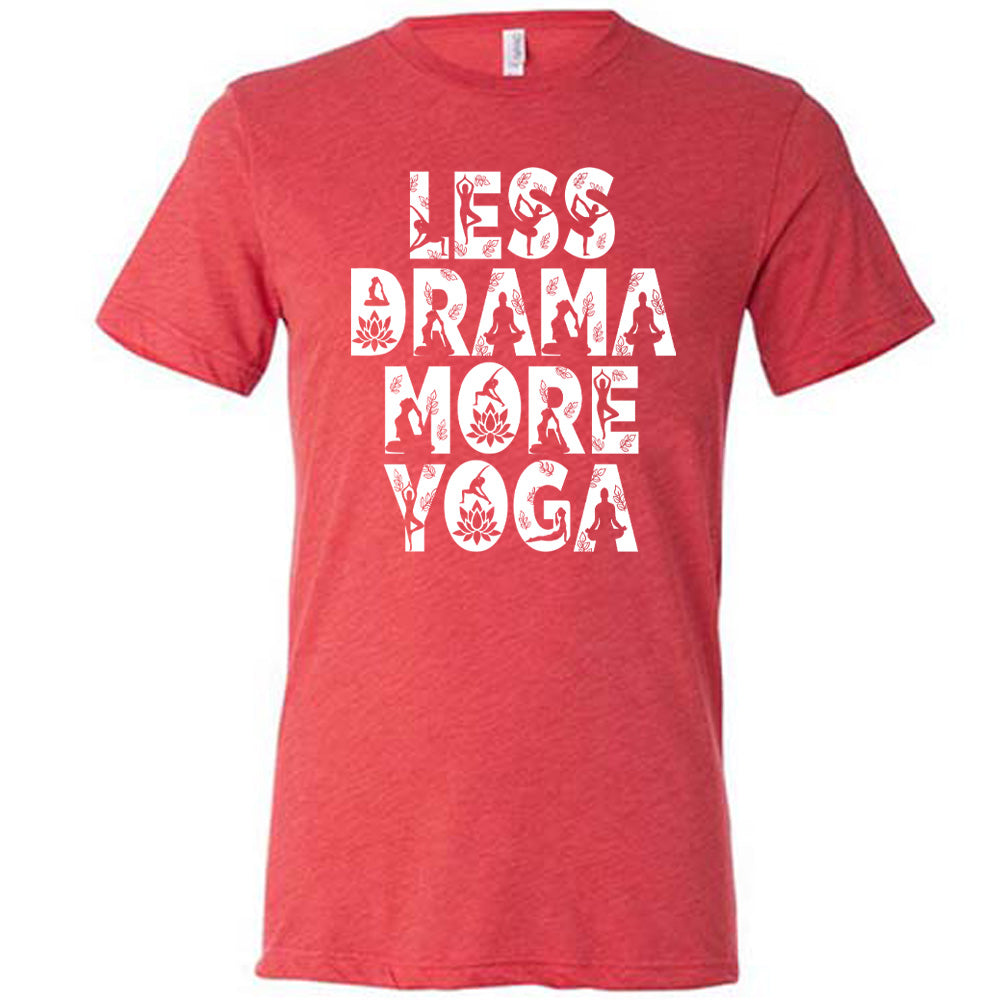 red unisex tee with the words "less drama more yoga" on it, and within each letter there are silhouettes of people doing yoga poses as well as some lotus flowers and some leaves