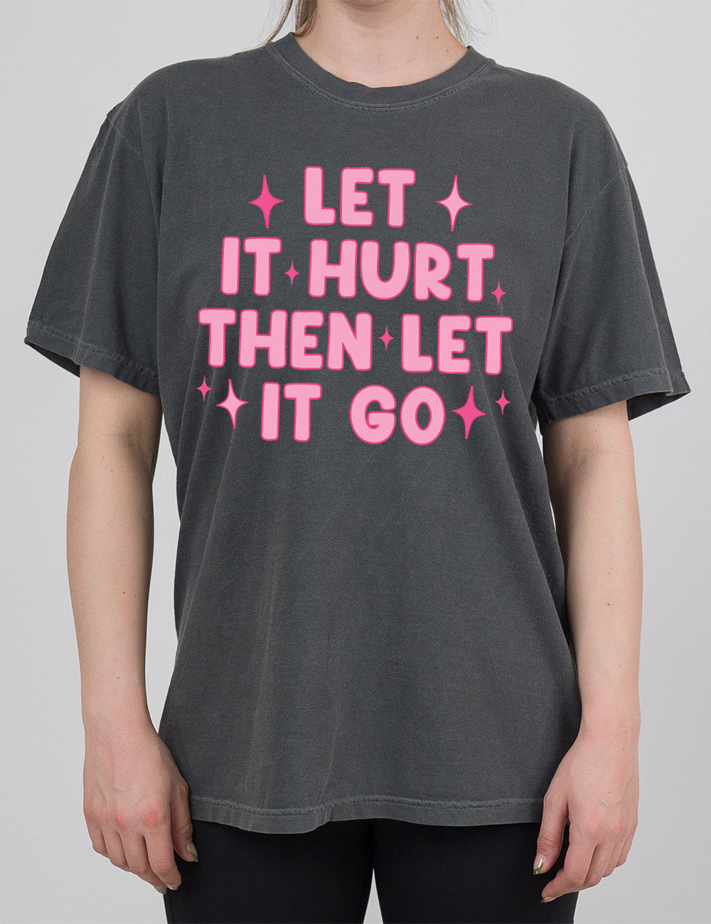 pepper modern tee with wording saying "let it hurt then let it go" with star graphics embellishing
