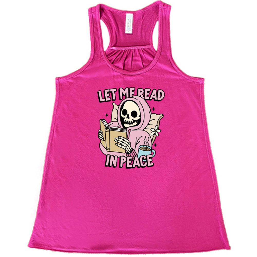 berry shirt with the text "Let Me Read In Peace" and a skeleton reading graphic on it