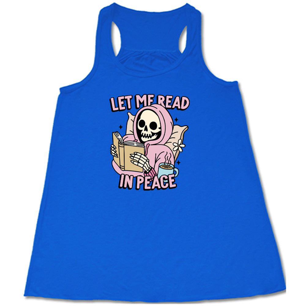 blue shirt with the text "Let Me Read In Peace" and a skeleton reading graphic on it