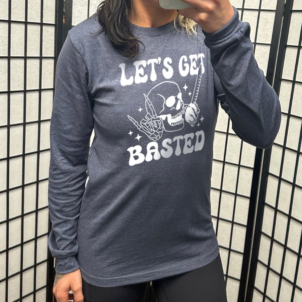 heather navy long sleeve with the words "Let's get blasted" in white letter, with the image of a skull with a rocker hand and another hand holding a turkey baster