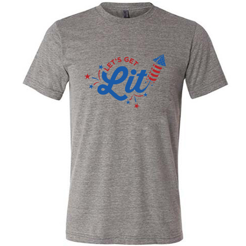 Grey colored shirt with a firework graphic on it that says "Lets Get Lit"