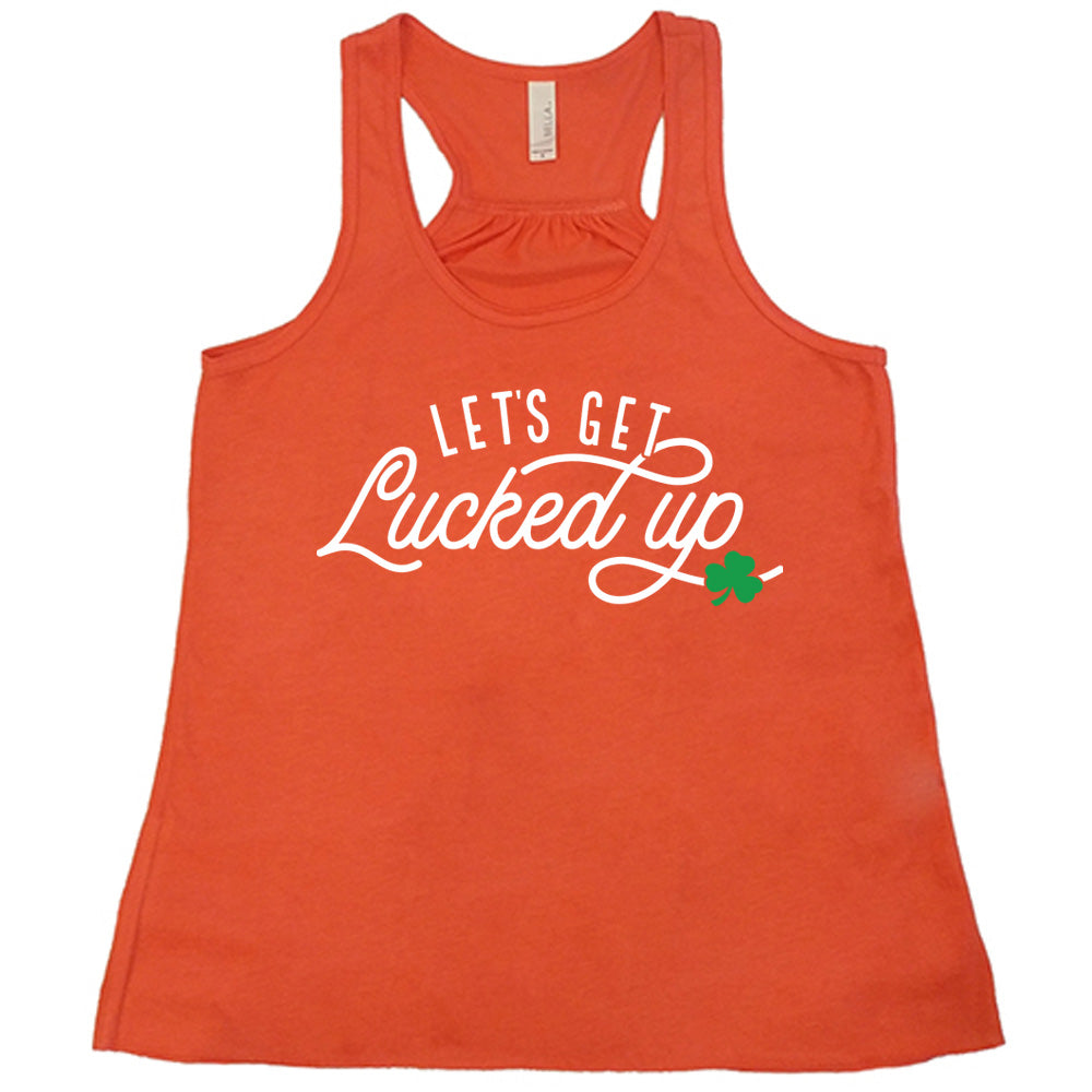coral flowy tank with the words "let's get lucked up" on it, with the small graphic of a shamrock