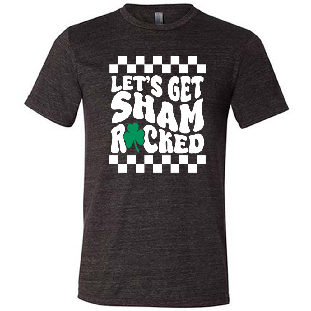 black unisex tee with the words "let's get shamrocked" on it, with a shamrock graphic replacing the "o" of "rocked", and a checkerboard border on top and bottom of the words