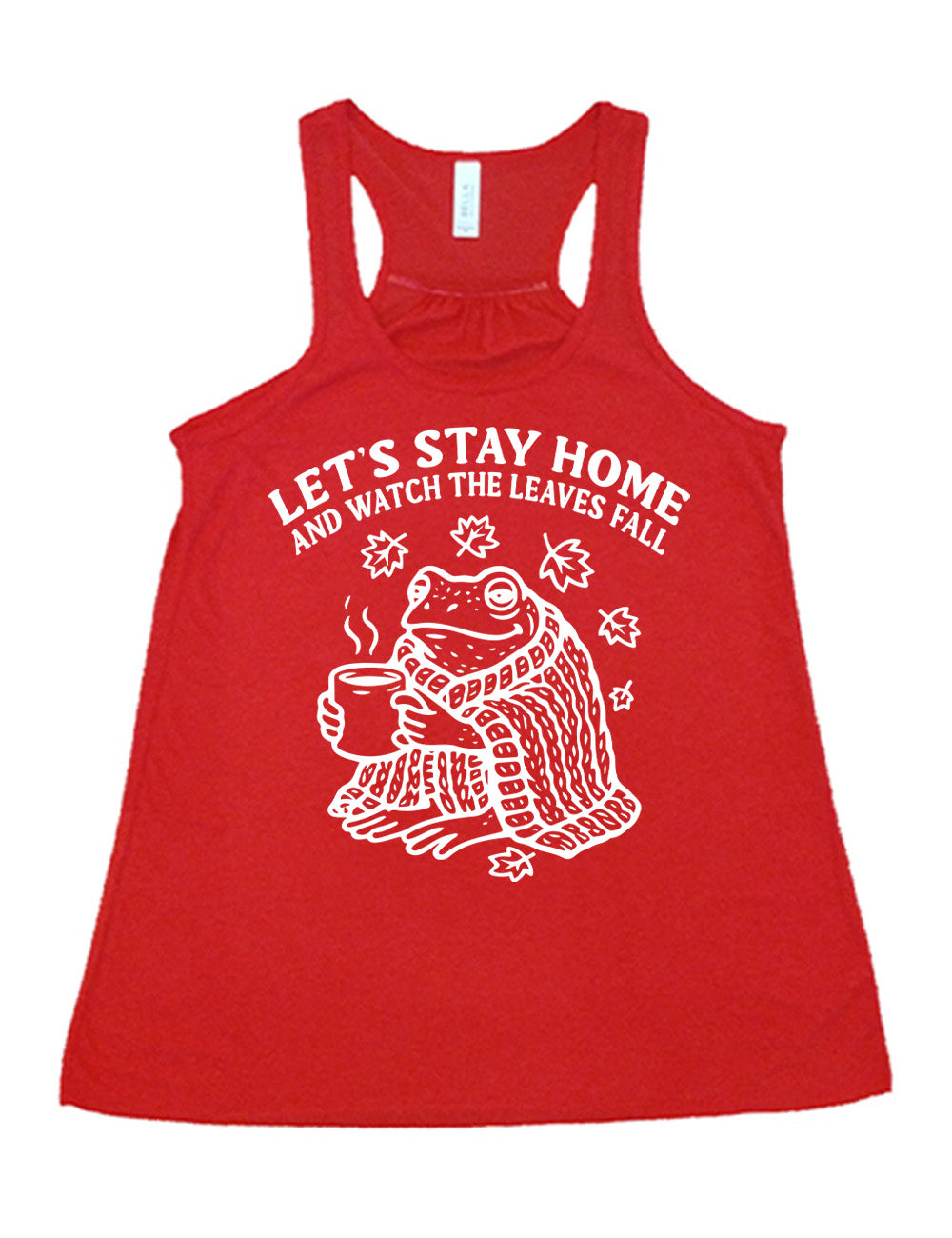 red flowy racerback tank with the words "let's stay home and watch the leaves fall" on it, and the graphic underneath of a frog, wrapped in a blanket, holding a mug of steaming beverage, with five leaves arching over it