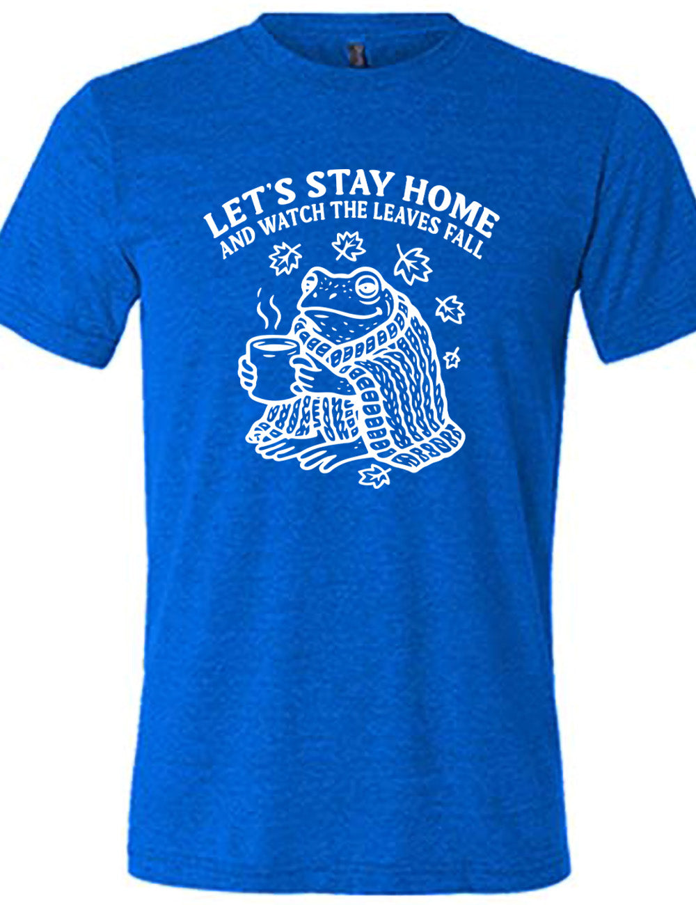 blue unisex tee with the words "let's stay home and watch the leaves fall" on it, and the graphic underneath of a frog, wrapped in a blanket, holding a mug of steaming beverage, with five leaves arching over it