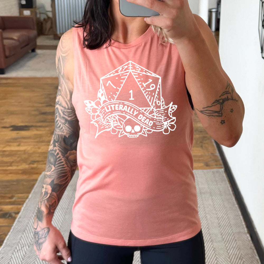 peach muscle tank with the graphic of a dungeons and dragons die (with the numbers 17, 3, 7, 1, 19, and 6 showing) above a skull among flowers, and a small banner reading "literally dead"