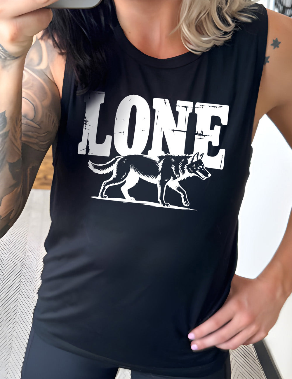 black muscle tank with the large all caps word "lone" on it, with a wolf graphic underneath