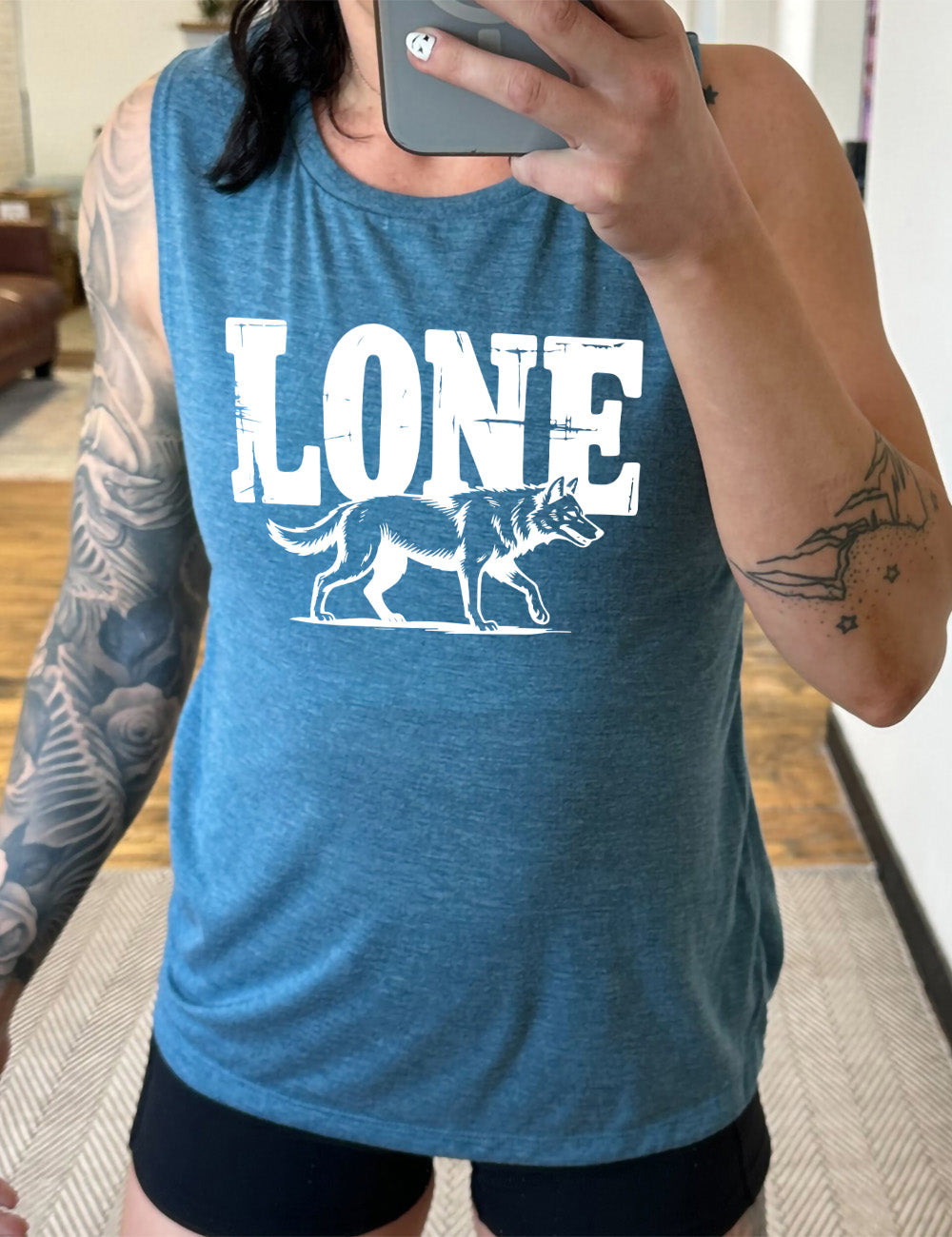 deep teal muscle tank with the large all caps word "lone" on it, with a wolf graphic underneath