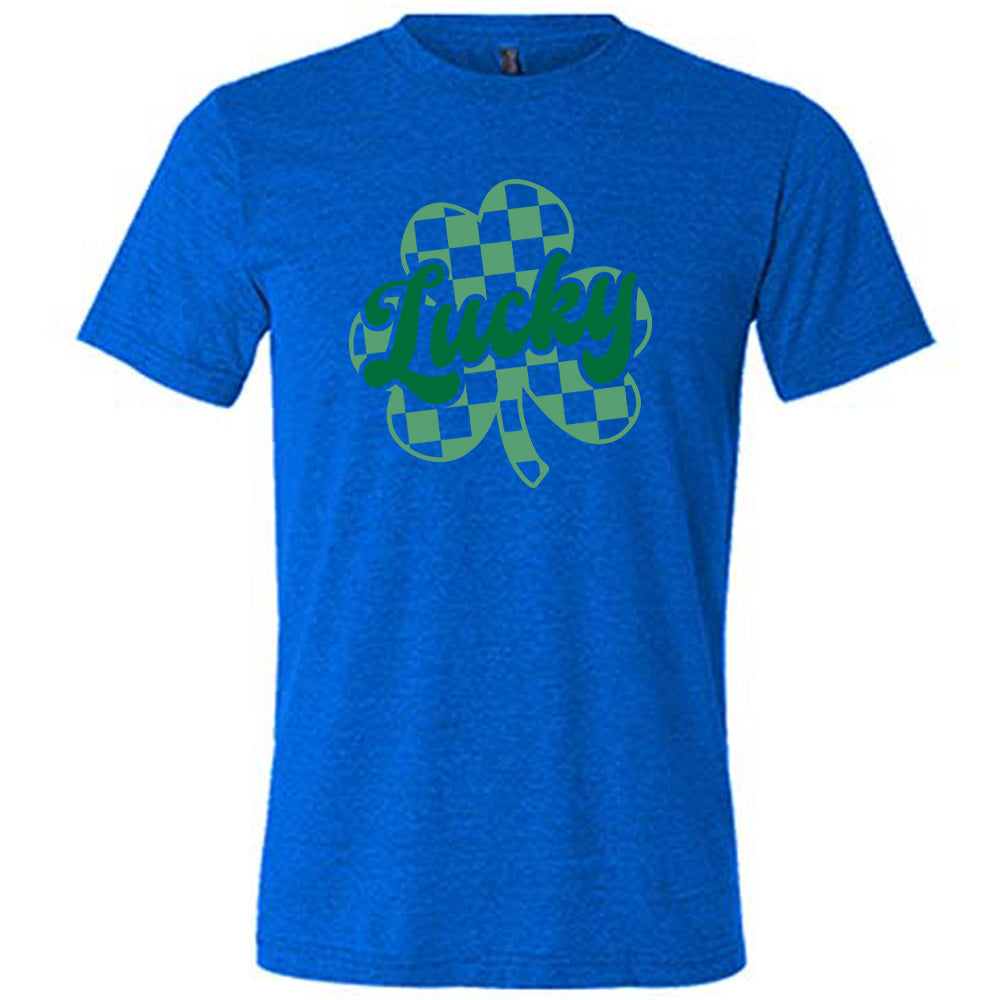 blue shirt with a checkered shamrock graphic on it