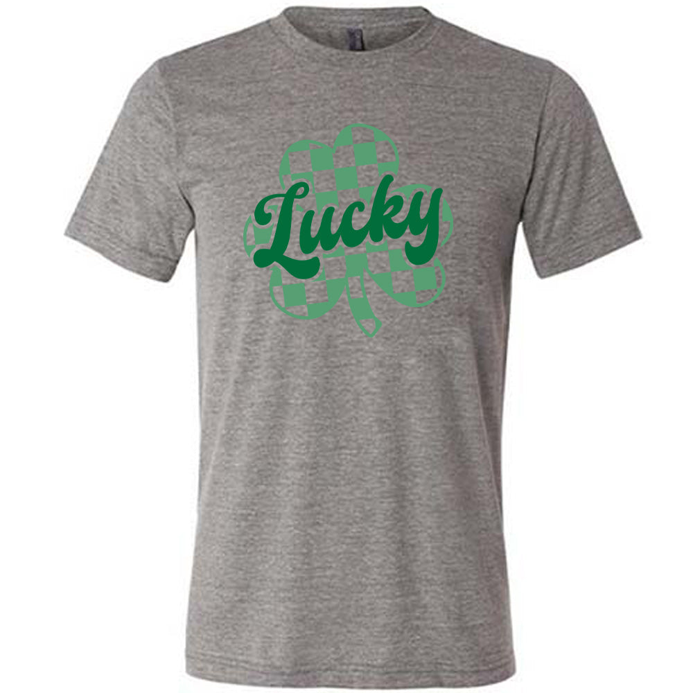 grey shirt with a checkered shamrock graphic on it