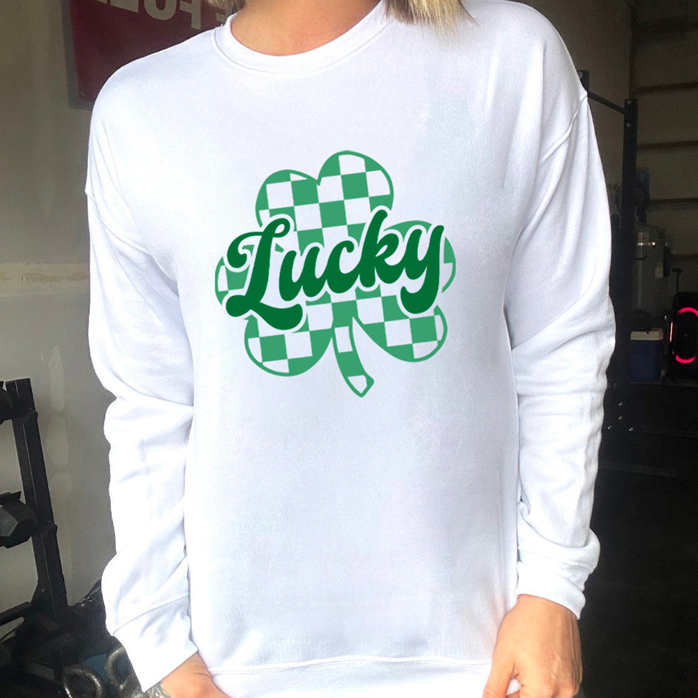 white crewneck with a checkered shamrock graphic on it