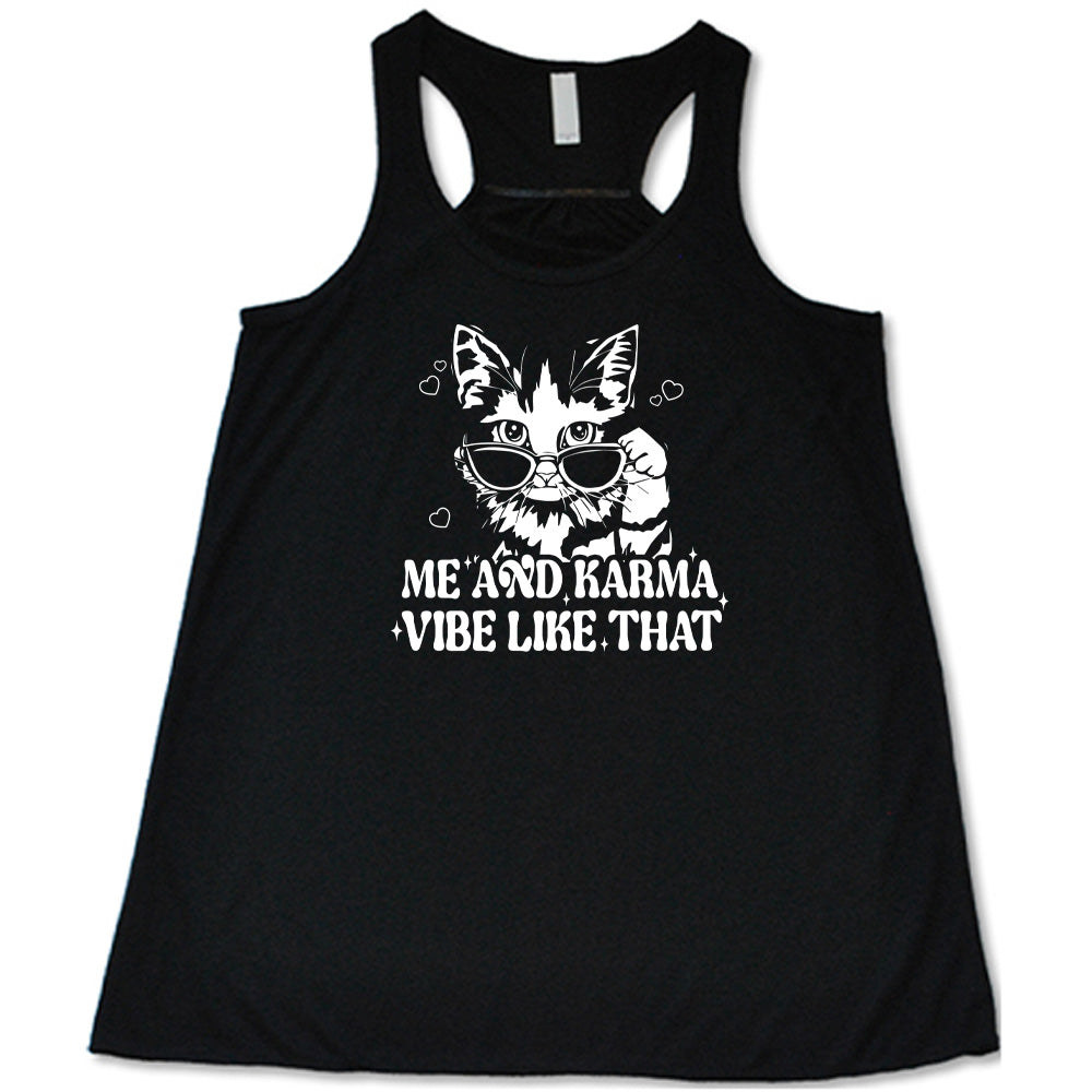 Black colored flowy tank with a cat wearing sunglasses graphic on it that says "Me and Karma Vibe Like That"