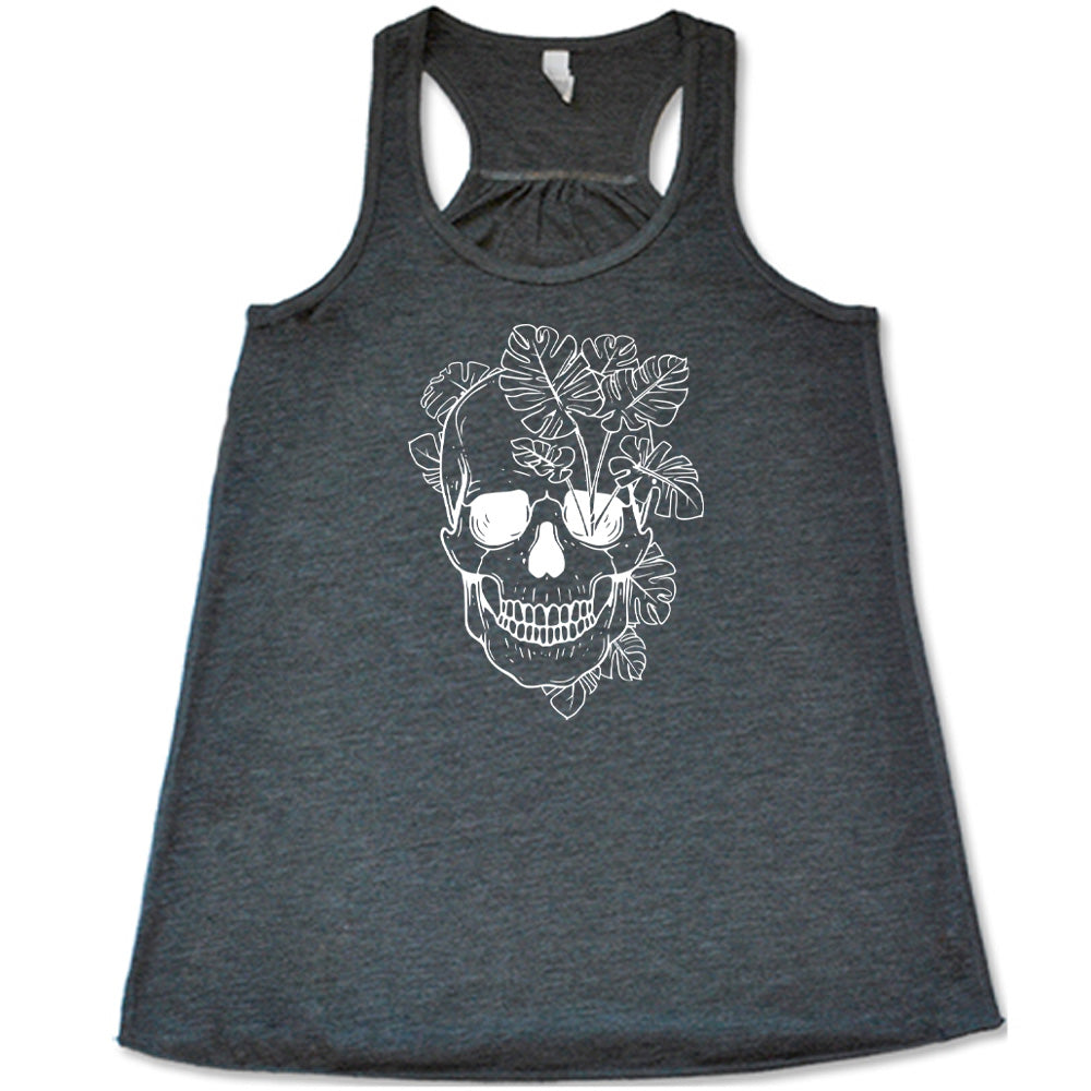 Grey colored flowy tank with a monstera plant and skull graphic on it