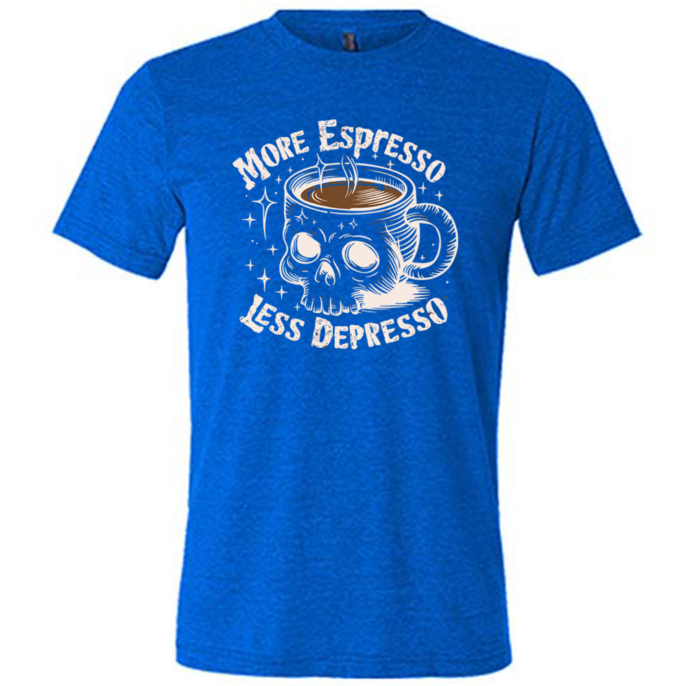 blue unisex tee with the words "more espresso less depresso on it, around the graphic of a skull-shaped mug full of a steaming beverage, with lots of little stars around